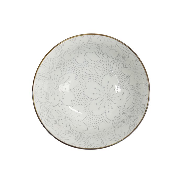 White ceramic bowl with delicate floral pattern and gold rim, top view