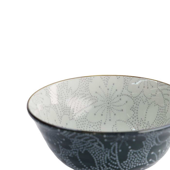 Ceramic bowl with intricate dotted floral pattern, ideal for kitchen or tableware use