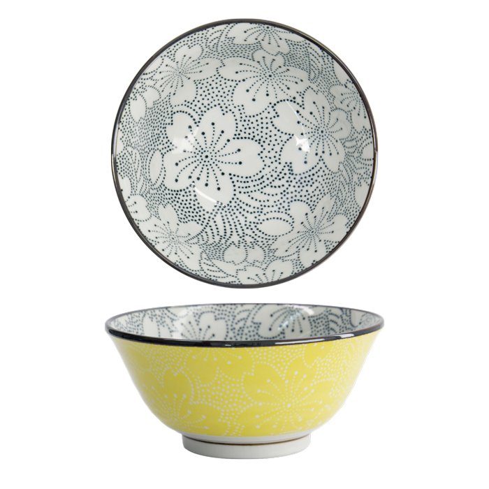 Ceramic bowl with yellow exterior and white floral pattern, dotted blue and white floral interior